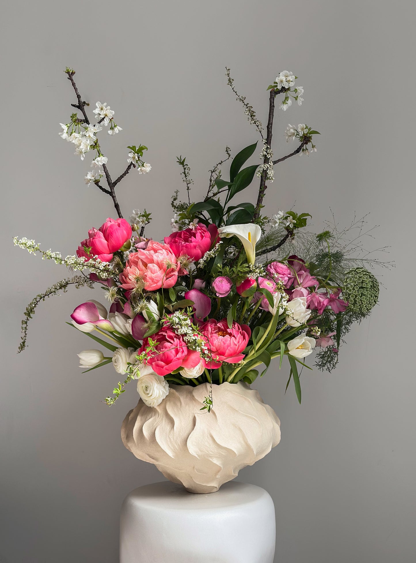 Bouquet of Peony Coral Charm, Ranunculus Butterfly and Blooming Branches